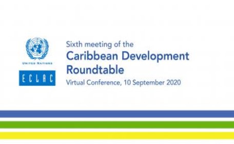 Banner of the sixth meeting of the Caribbean Development Roundtable with blue and white ECLAC logo over three lines in blue, green and yellow.