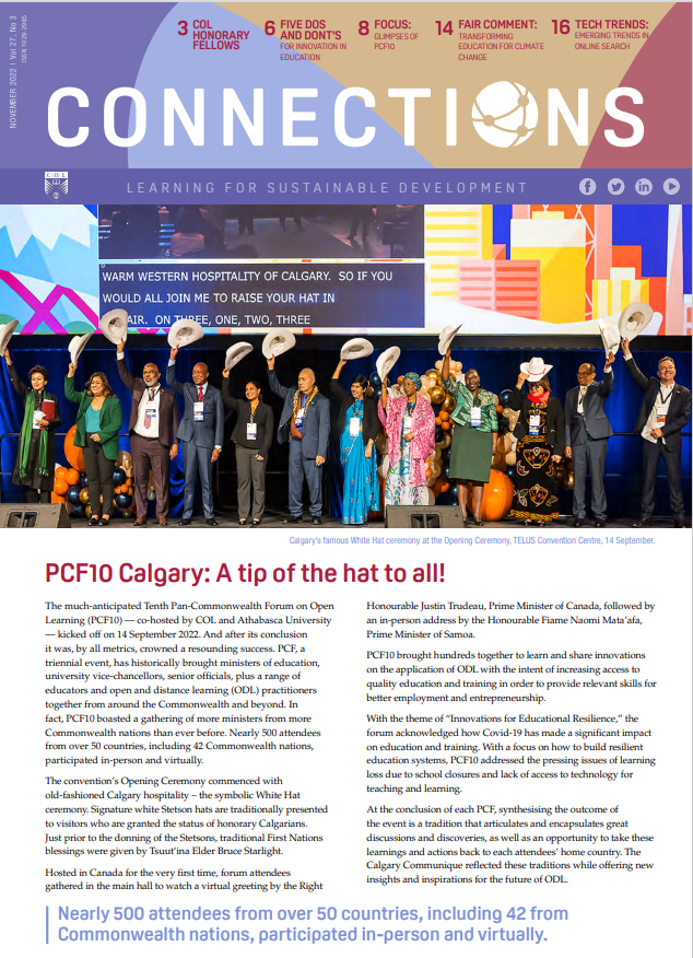 Purple, blue, beige, white and burgundy cover with black, white, blue and red text. There is a picture of Meeting participants waving their hats.